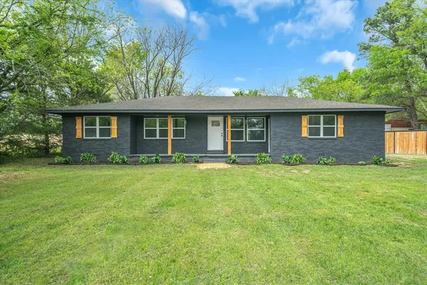 front view of a house with a yard