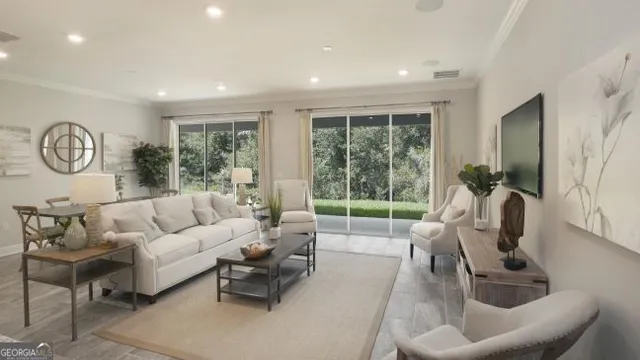 a living room with furniture and a large window