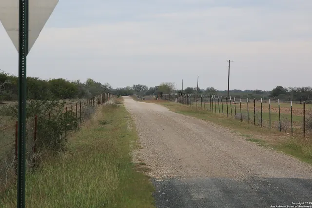 a view of a lake with houses in the back