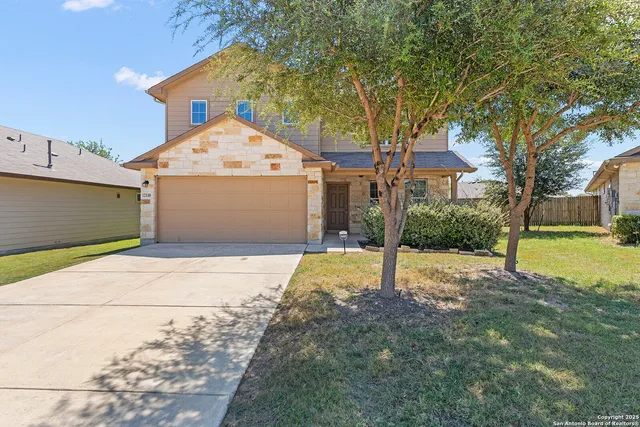 a house with trees in front of it