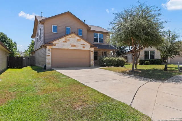 a view of garage and yard