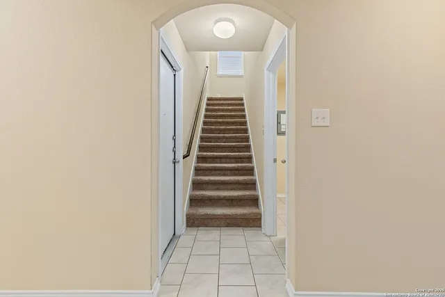 a kitchen with stainless steel appliances a refrigerator and a stove top oven