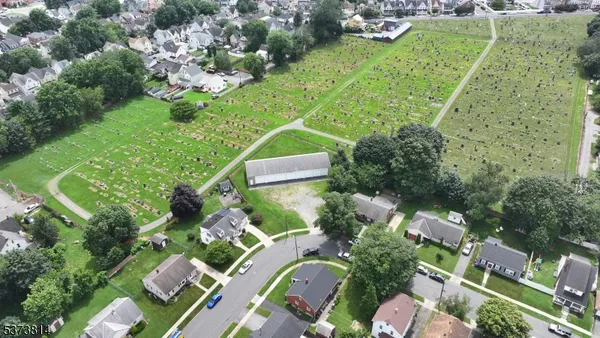 an aerial view of residential house with outdoor space and swimming pool
