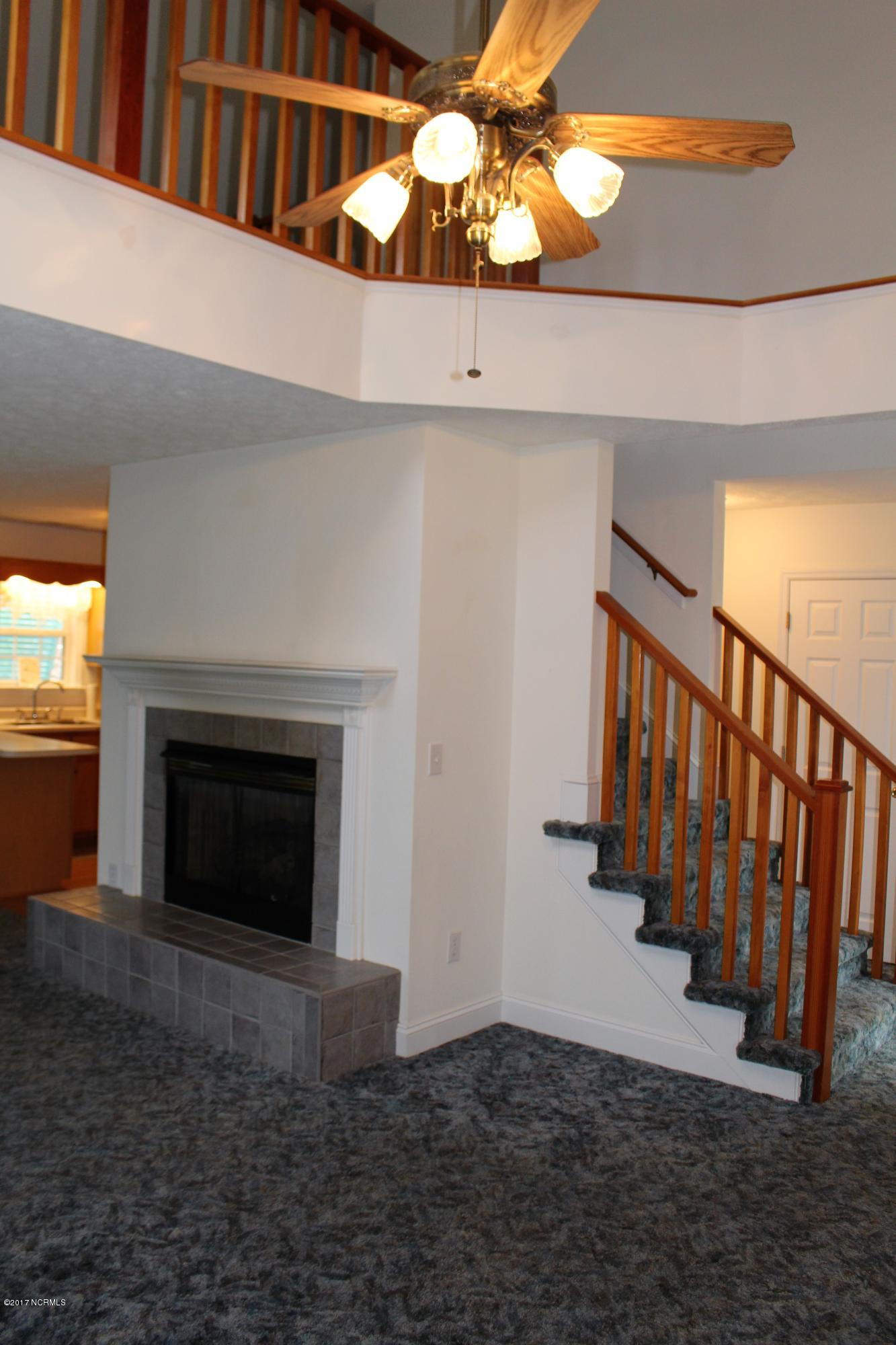 451 Becton Road Havelock, NC 28532 - Photo 49 of 87 living room stairs going up to top level with finished loft and bedroom