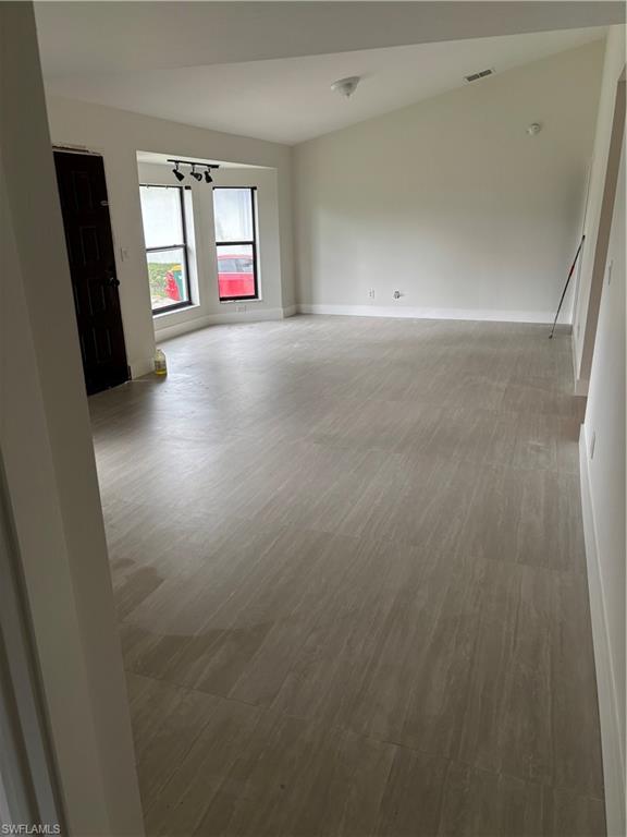 175 5th Street South Naples, FL 34102 - Photo 5 of 8 an empty room with windows and fireplace