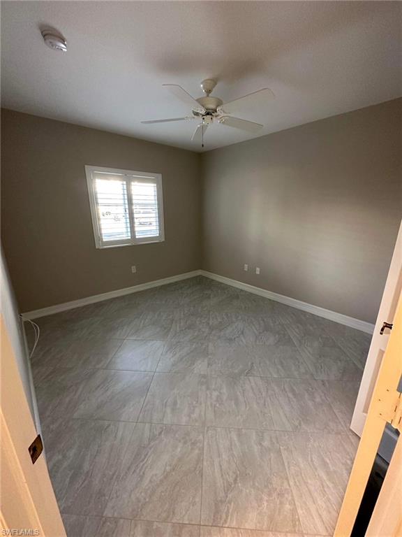 175 5th Street South Naples, FL 34102 - Photo 6 of 8 an empty room with a window