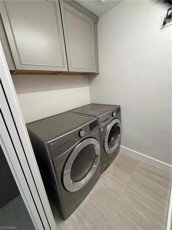 175 5th Street South Naples, FL 34102 - Photo 8 of 8 a utility room with dryer and washer
