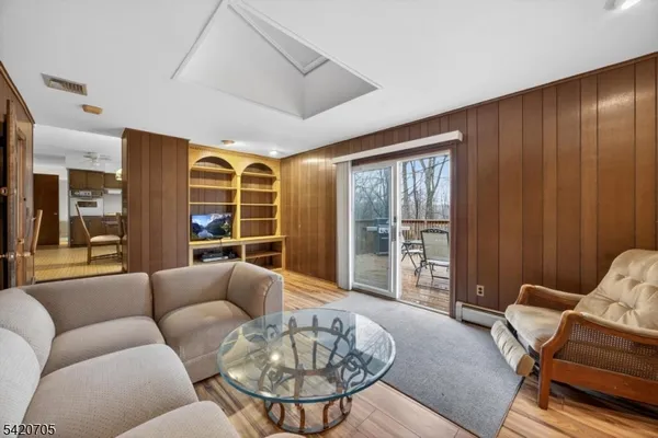 a kitchen with a sink cabinets and dining table chair
