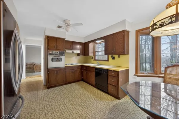 a kitchen with a sink and wooden cabinets