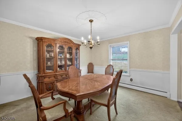 a bedroom with a large bed and a dresser