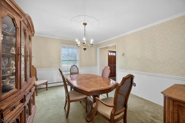 a bathroom with a toilet sink vanity and mirror