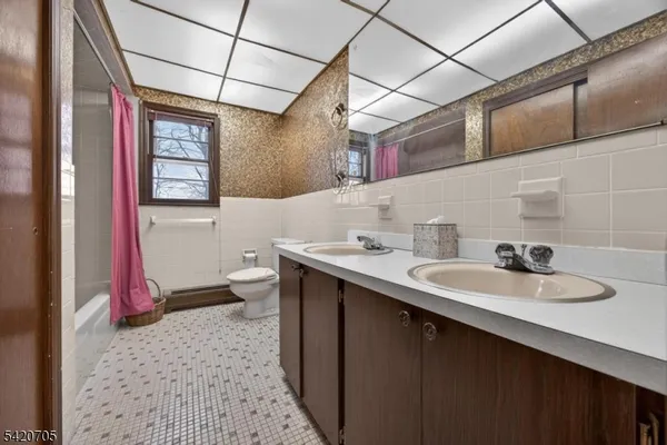 a view of a room with wooden walls