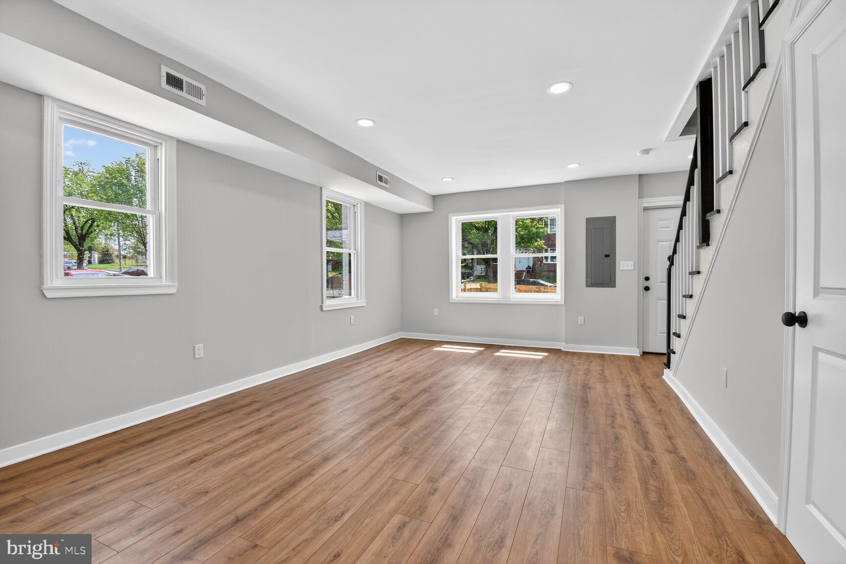 305 Decatur Street Northwest Washington, DC 20011 - Photo 10 of 21 a view of an empty room with wooden floor and a window