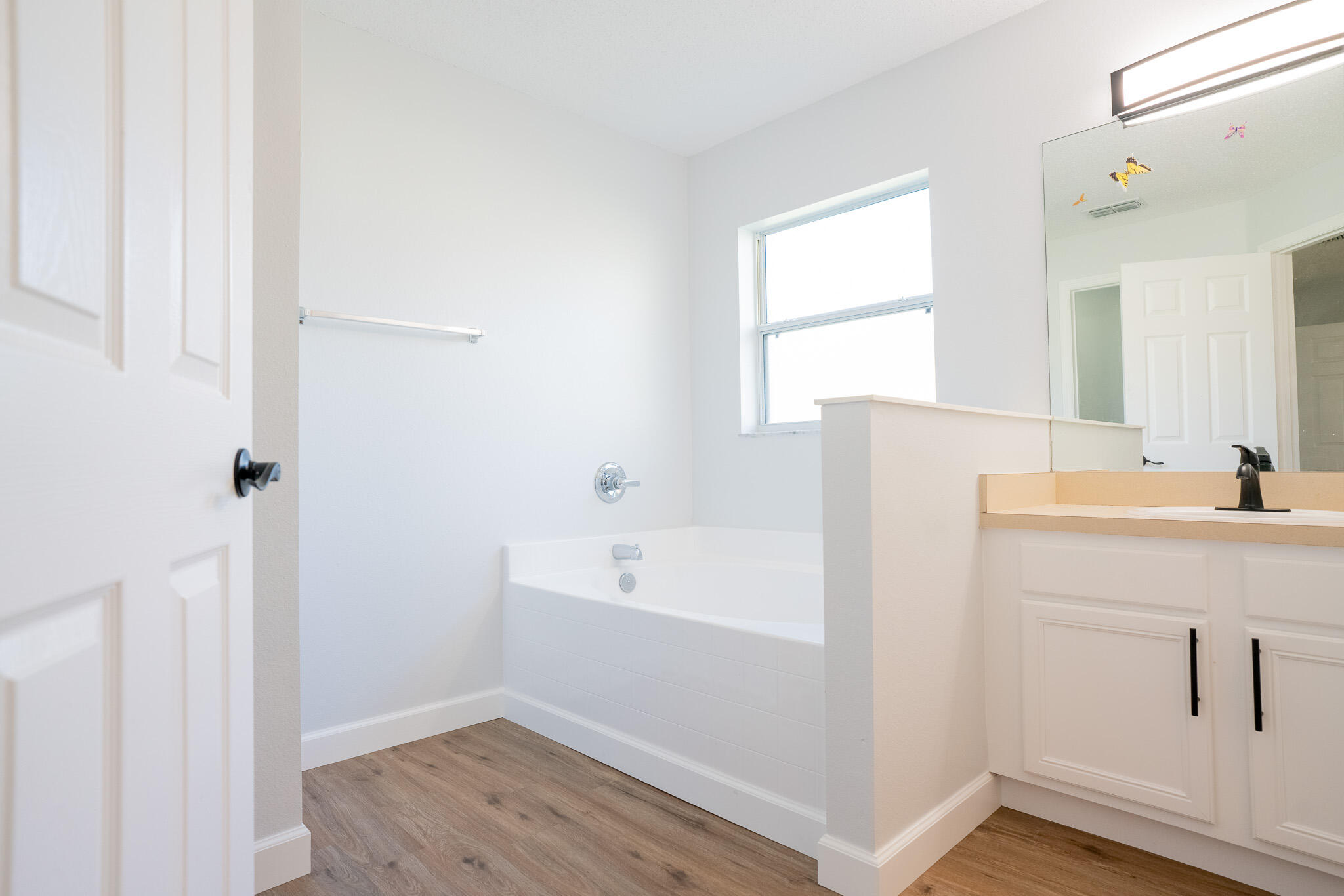 2001 Southwest Ember Street Port St. Lucie, FL 34953 - Photo 13 of 22 a bathroom with a sink and a bathtub