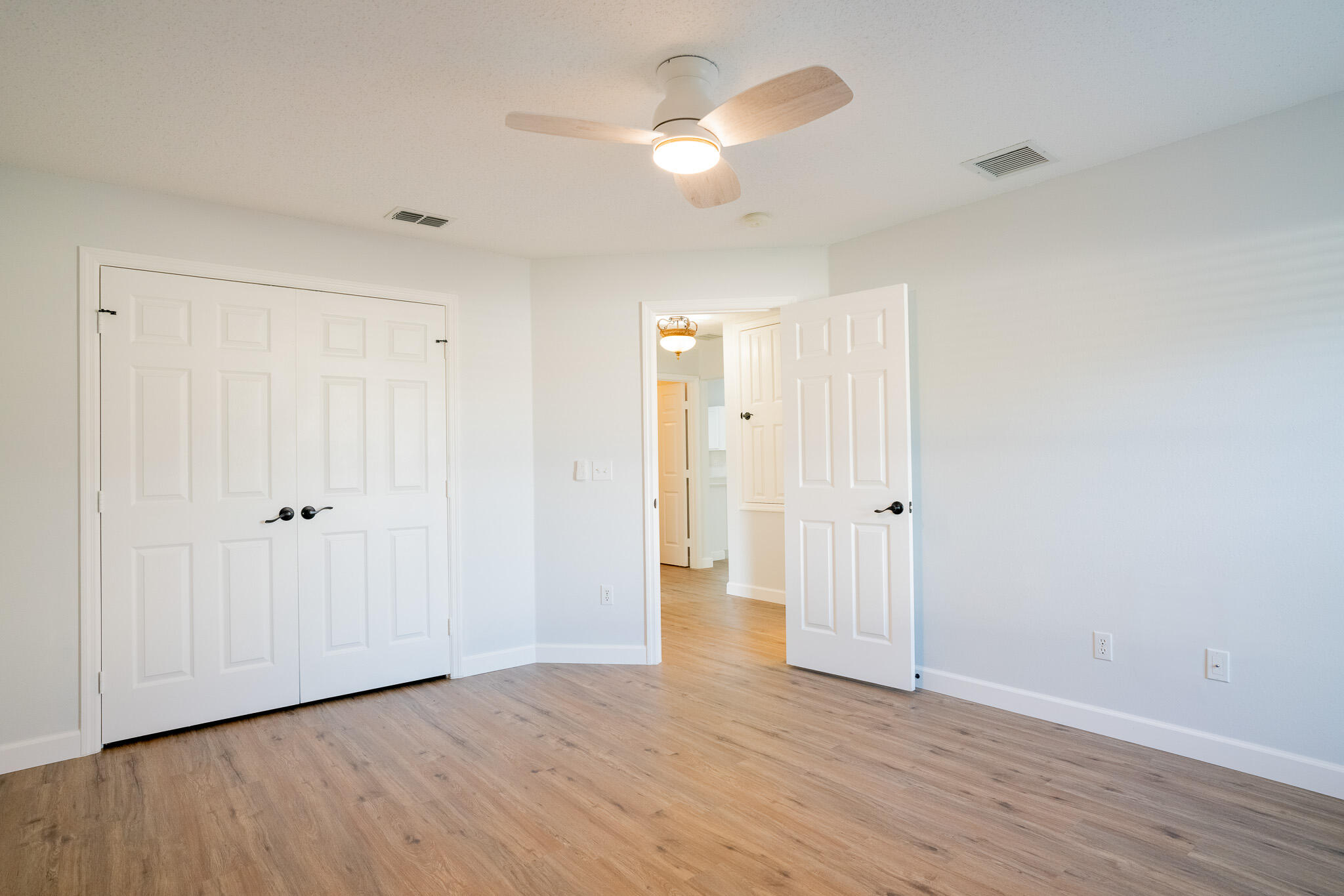 2001 Southwest Ember Street Port St. Lucie, FL 34953 - Photo 18 of 22 a view of empty room with wooden floor