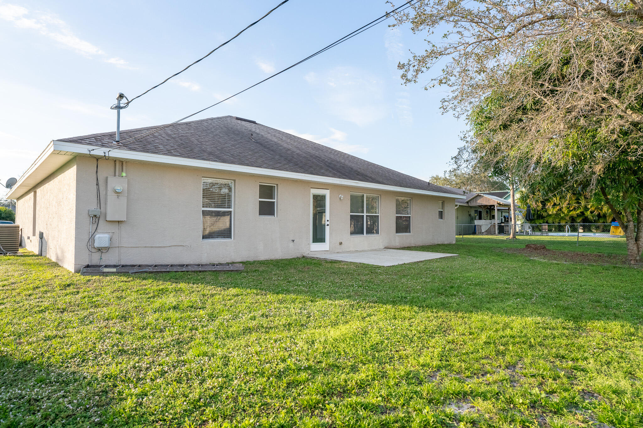2001 Southwest Ember Street Port St. Lucie, FL 34953 - Photo 22 of 22 a view of a house with a outdoor space
