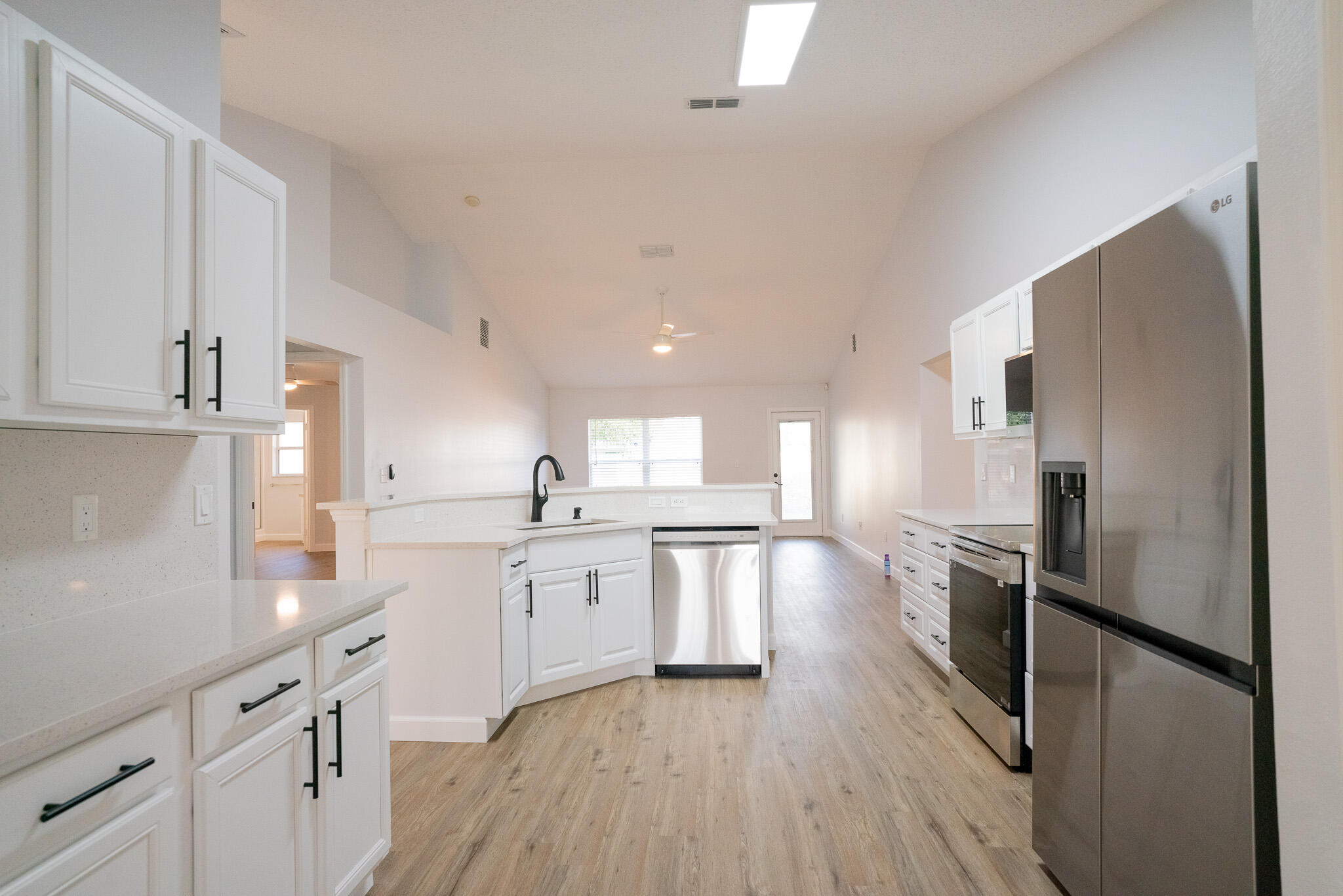 2001 Southwest Ember Street Port St. Lucie, FL 34953 - Photo 5 of 22 a large kitchen with cabinets stainless steel appliances a sink and a counter top space