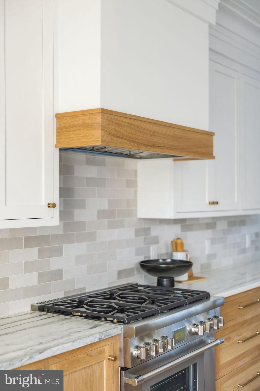 2460 Ontario Road Northwest Washington, DC 20009 - Photo 27 of 85 a kitchen with stove and cabinets
