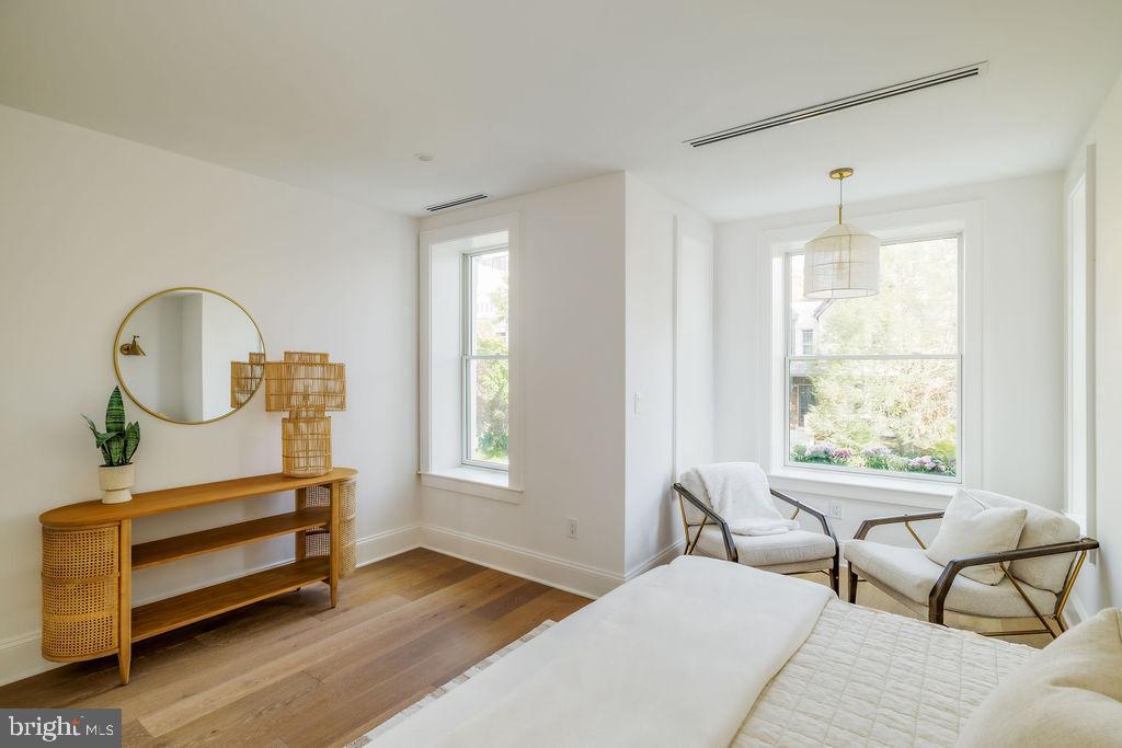 2460 Ontario Road Northwest Washington, DC 20009 - Photo 34 of 85 a bedroom with a bed a window and dresser