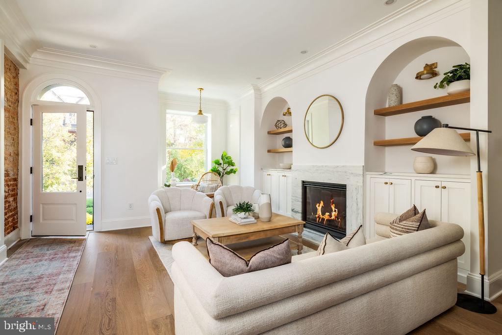 2460 Ontario Road Northwest Washington, DC 20009 - Photo 4 of 85 a living room with furniture a fireplace and a window