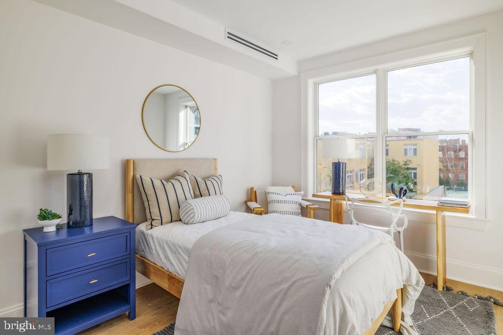 2460 Ontario Road Northwest Washington, DC 20009 - Photo 49 of 85 a bed room with a bed and a window