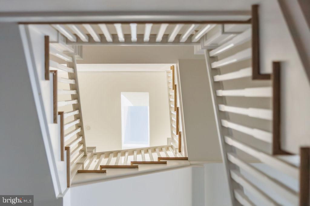 2460 Ontario Road Northwest Washington, DC 20009 - Photo 56 of 85 a view of staircase with white walls and a window