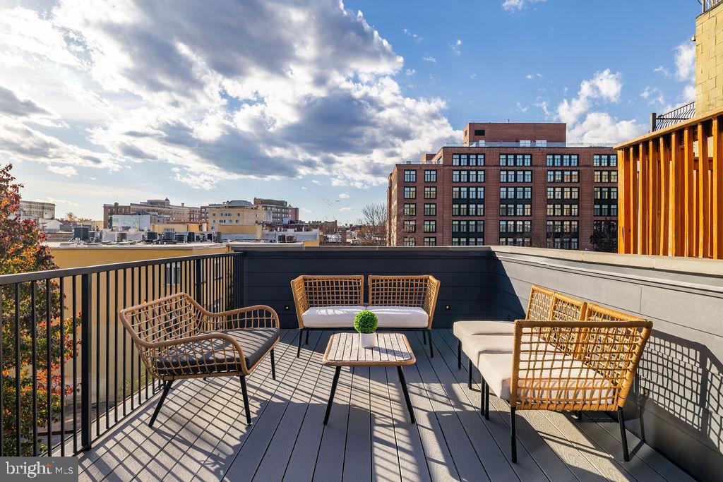 2460 Ontario Road Northwest Washington, DC 20009 - Photo 60 of 85 a view of a balcony with wooden floor