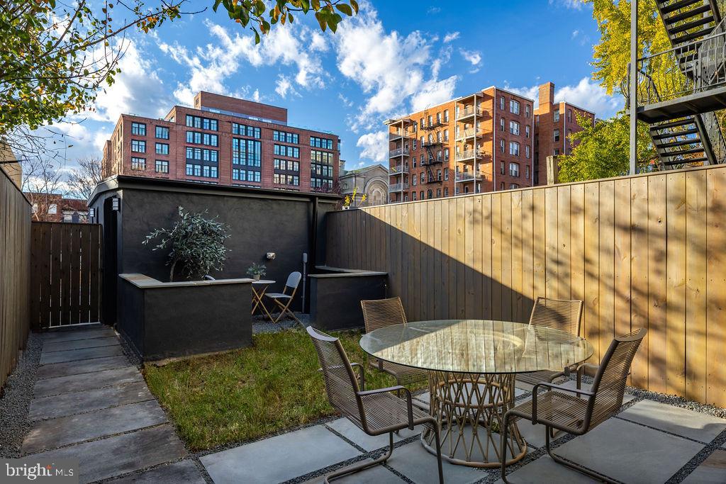 2460 Ontario Road Northwest Washington, DC 20009 - Photo 74 of 85 a view of a balcony with chairs and a potted plant