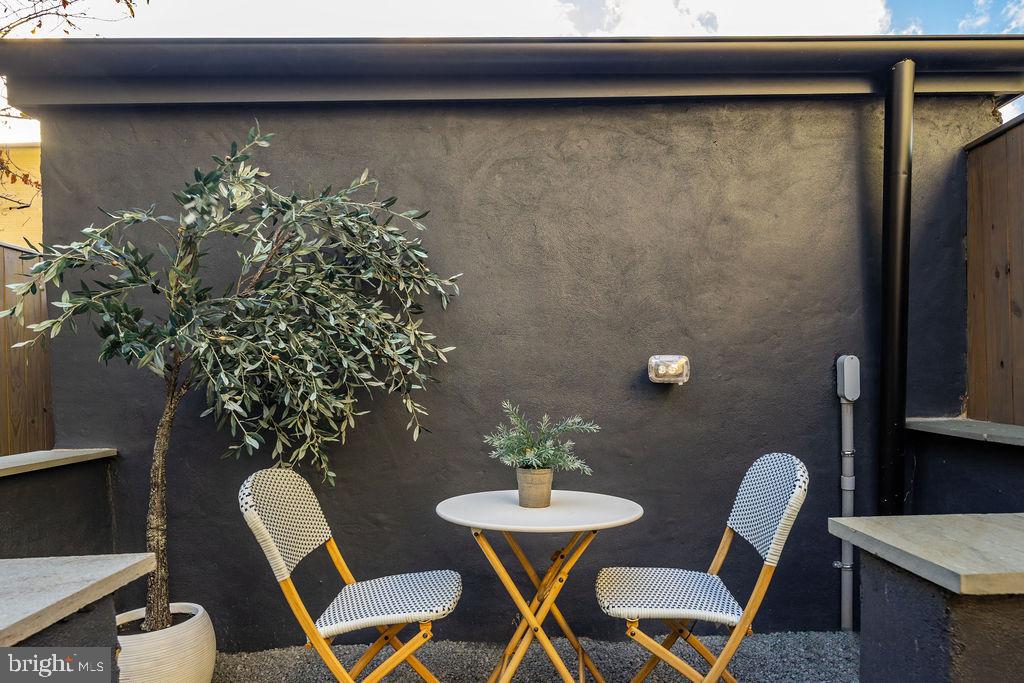2460 Ontario Road Northwest Washington, DC 20009 - Photo 75 of 85 a view of a dining room with furniture and wooden floor