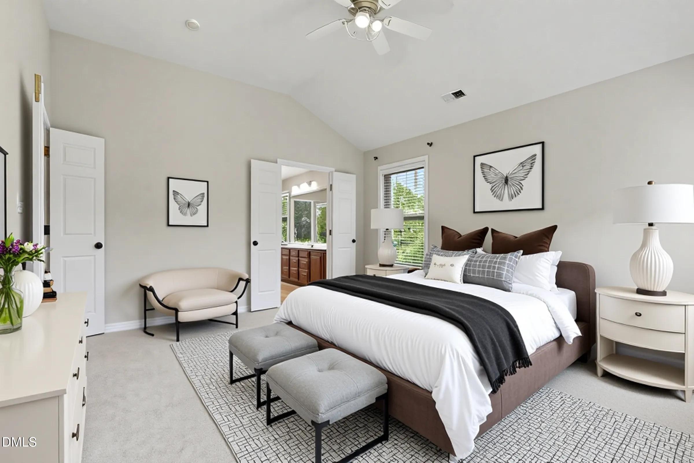 1001 Denfield Court Raleigh, NC 27615 - Photo 6 of 44 a spacious bedroom with a bed and a couch