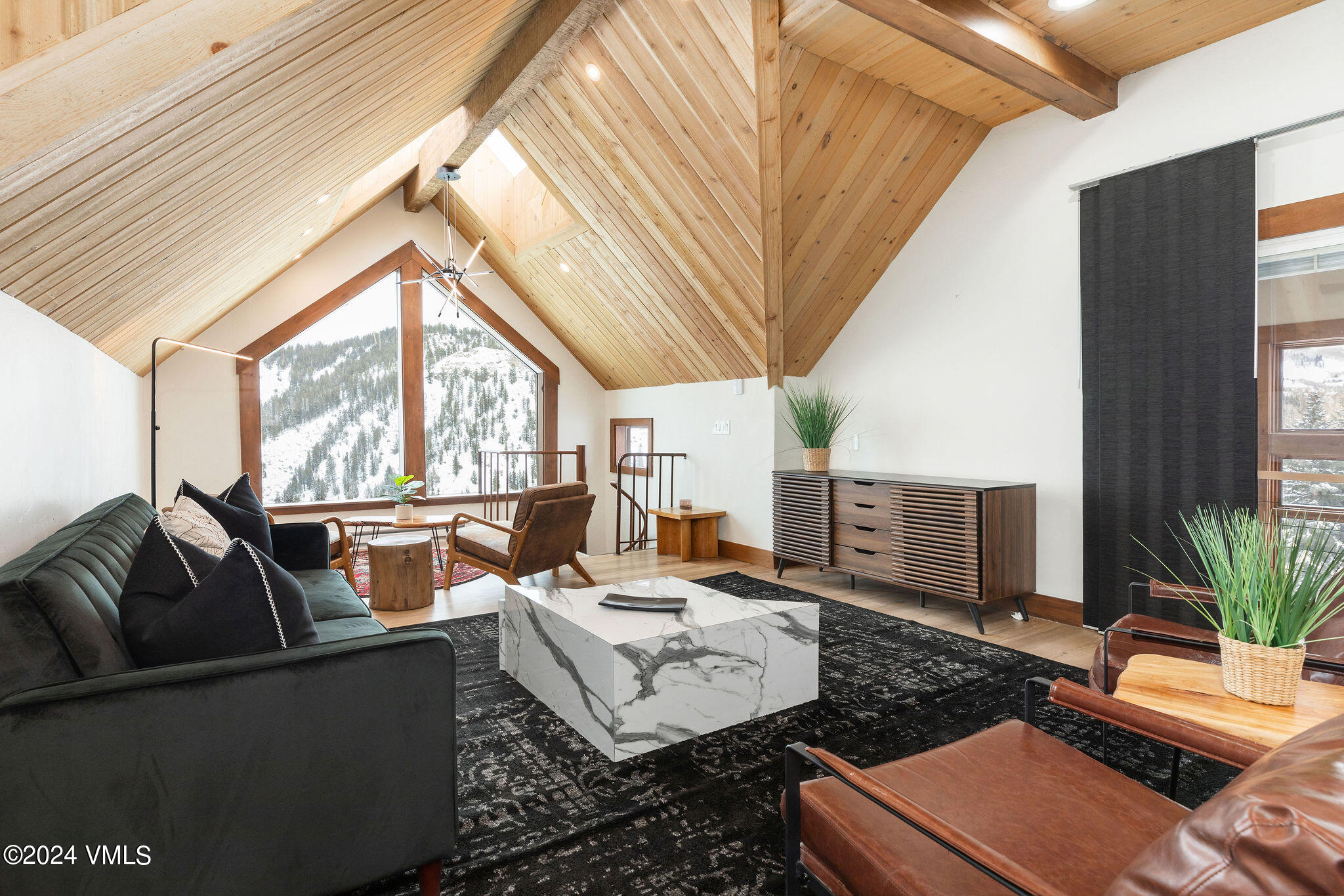 377 Holden Road Beaver Creek, CO 81620 - Photo 12 of 33 a living room with furniture and a large window