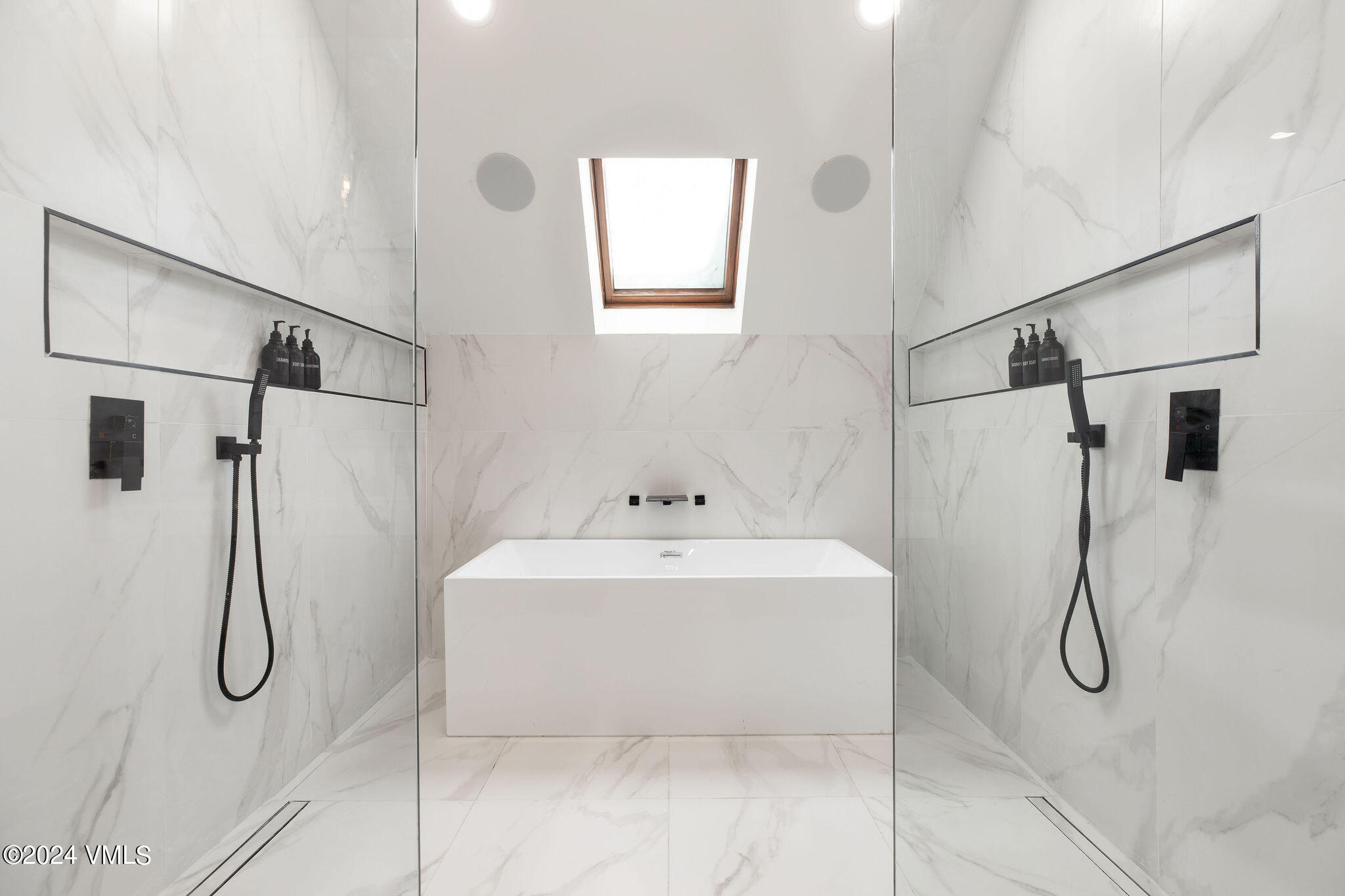 377 Holden Road Beaver Creek, CO 81620 - Photo 14 of 33 a bathroom with a sink a mirror and a shower