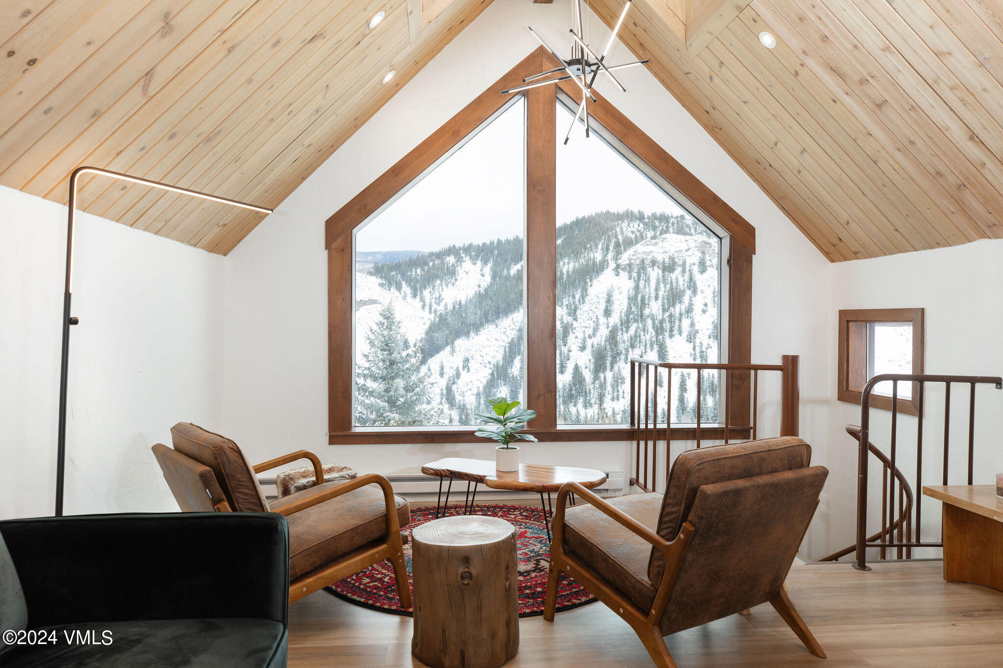 377 Holden Road Beaver Creek, CO 81620 - Photo 15 of 33 a living room with furniture and a floor to ceiling window