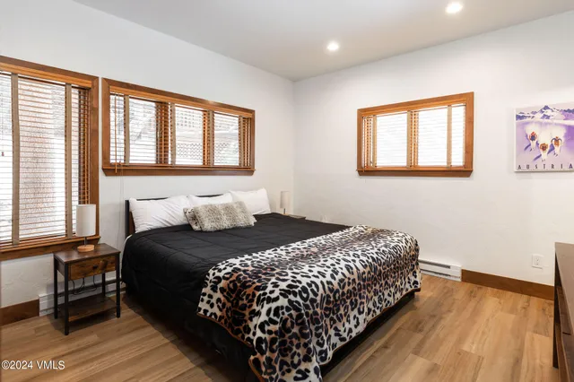 a bedroom with bed and a window