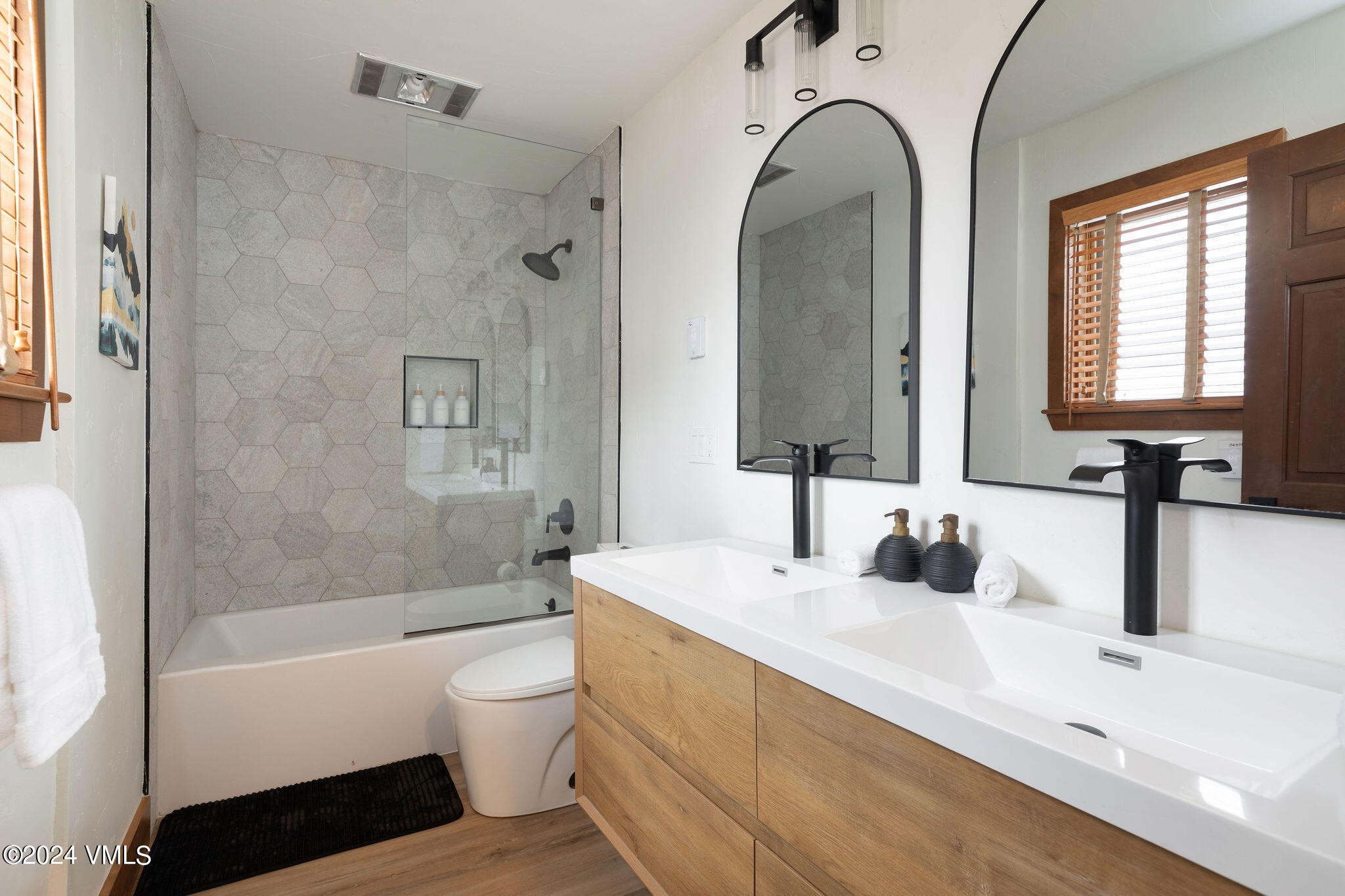 377 Holden Road Beaver Creek, CO 81620 - Photo 18 of 33 a bathroom with a double vanity sink a toilet and a tub
