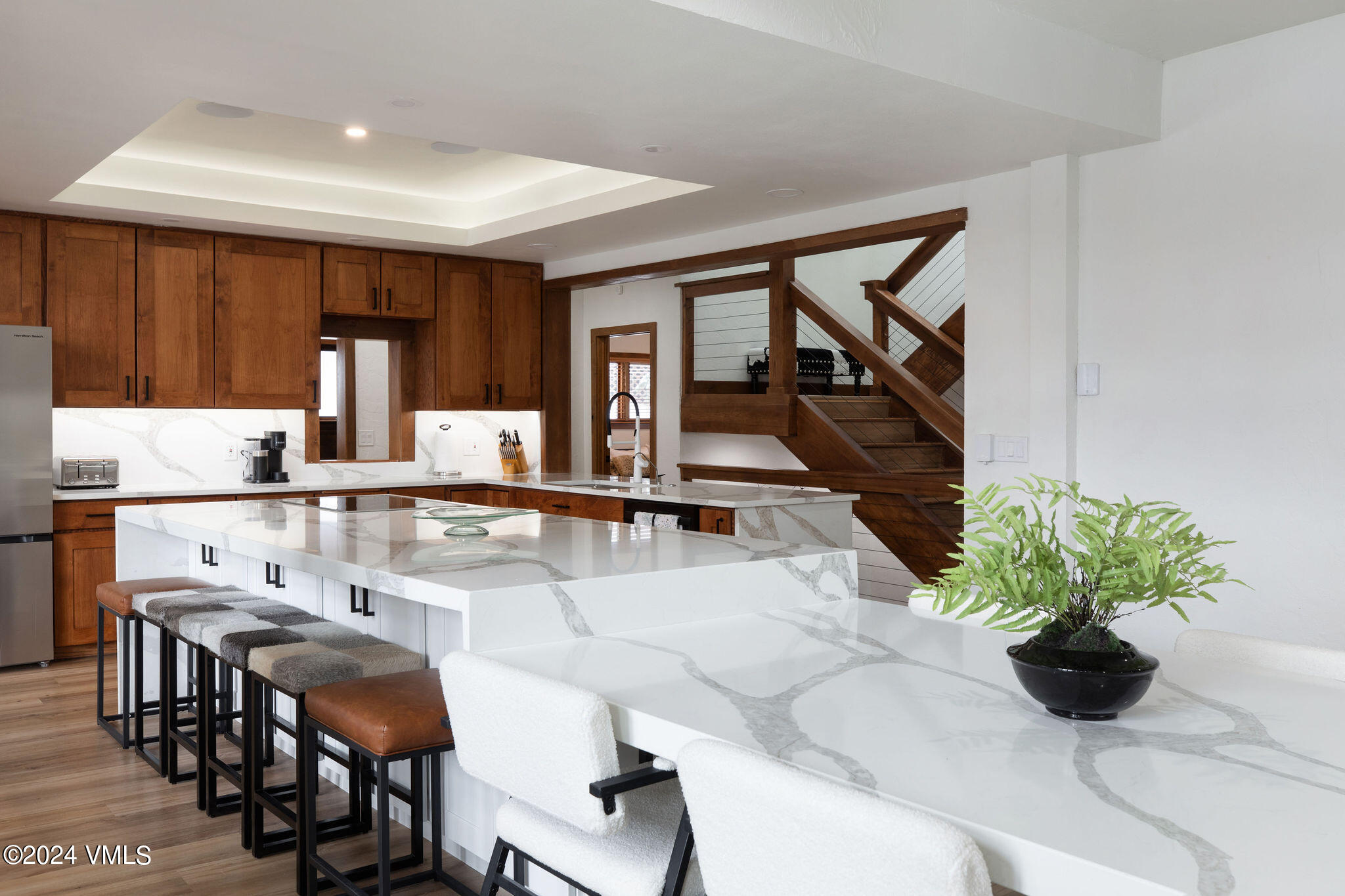 377 Holden Road Beaver Creek, CO 81620 - Photo 4 of 33 a dining room with furniture and a potted plant