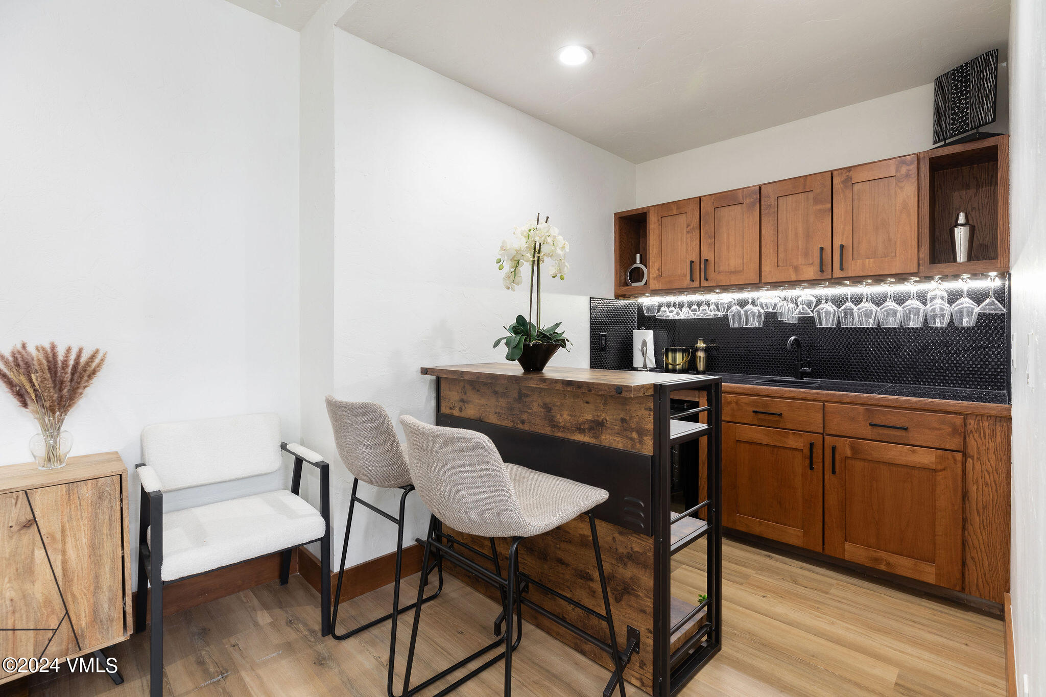 377 Holden Road Beaver Creek, CO 81620 - Photo 9 of 33 a kitchen with a table chairs and a refrigerator
