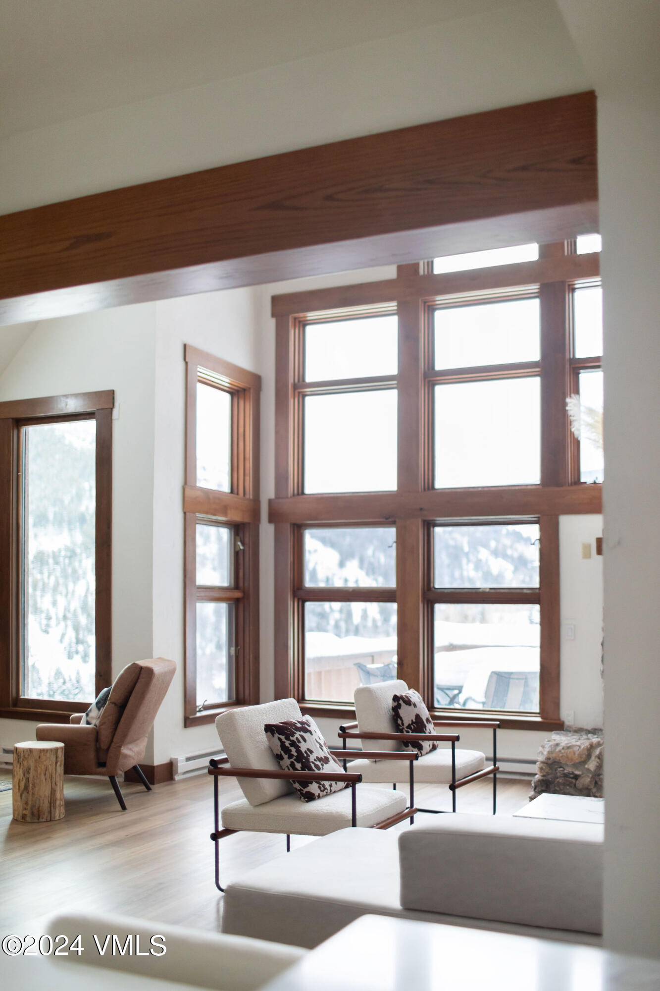 377 Holden Road Beaver Creek, CO 81620 - Photo 10 of 33 a living room with furniture and floor to ceiling windows