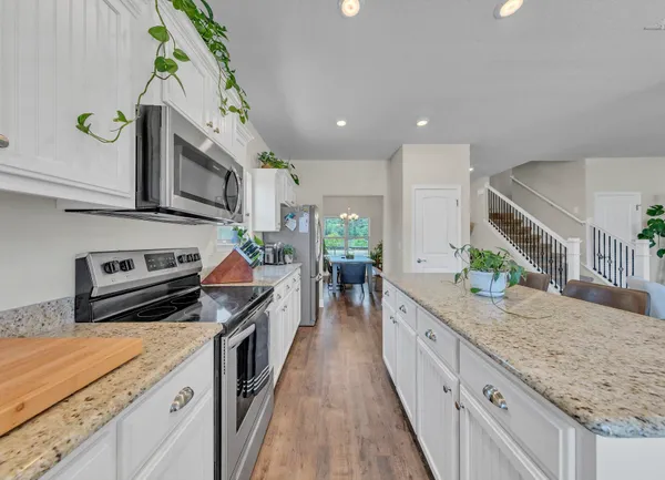 a kitchen with kitchen island granite countertop lots of counter top space