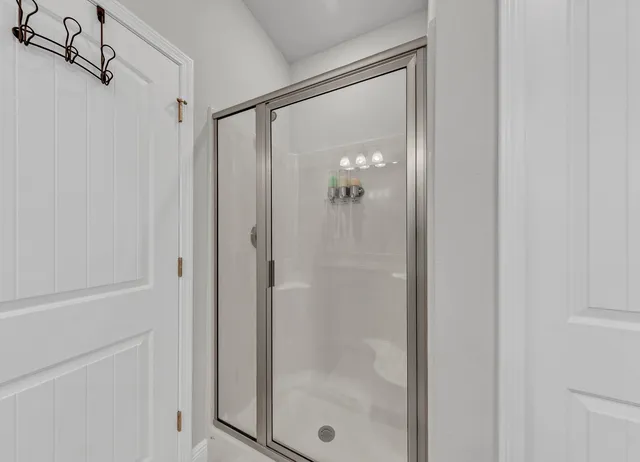 a pathway of a house with a yard