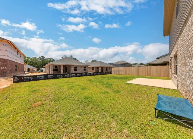 a view of house with yard