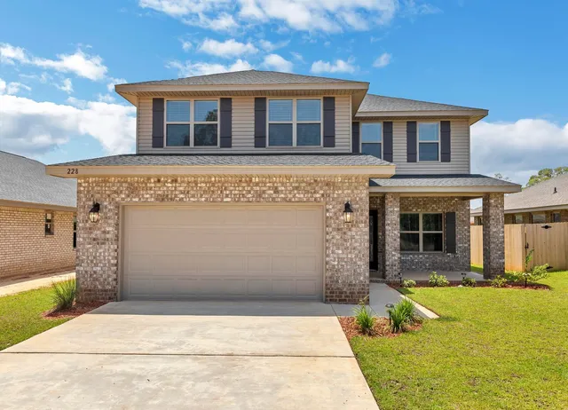 a front view of a house with swimming pool and glass windows