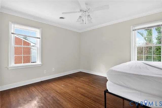 a bathroom with a toilet a sink and a mirror