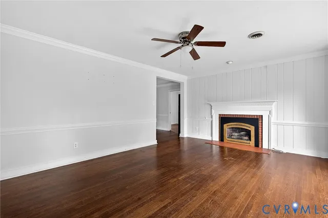 a view of a room with wooden floor and window