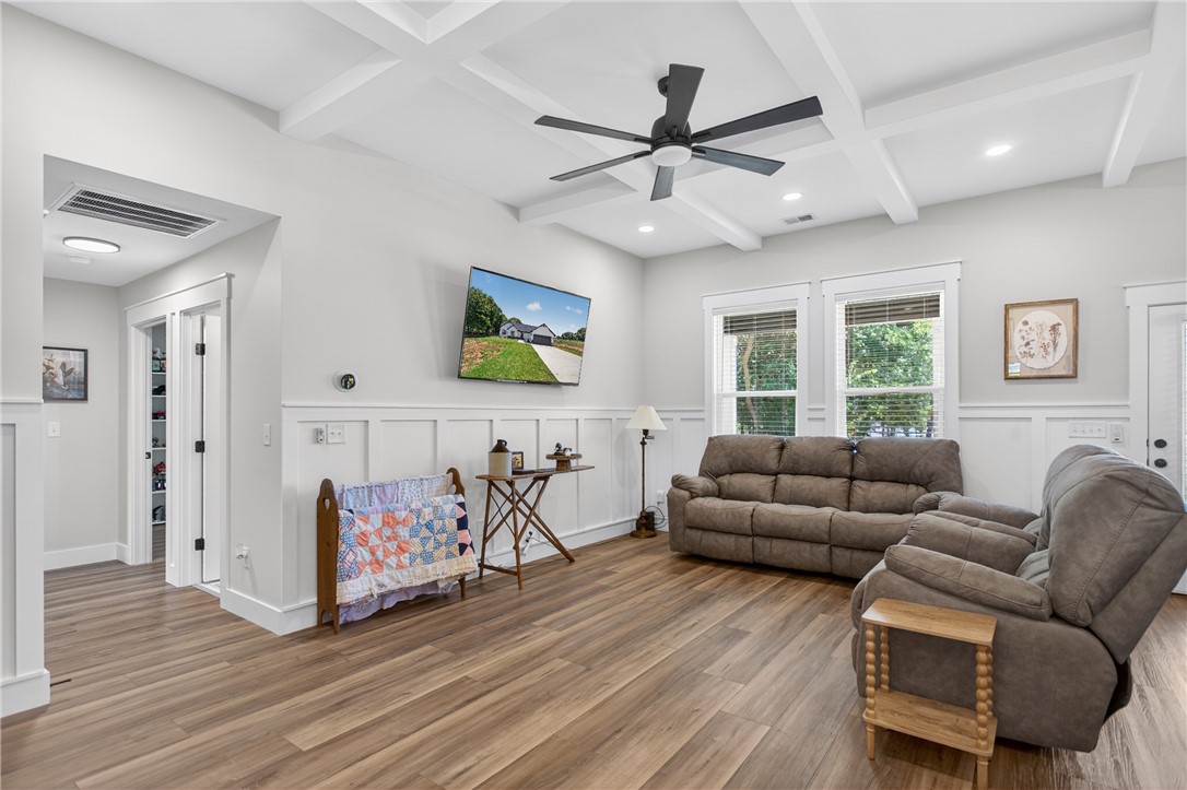 106 Bolt Road Townville, SC 29689 - Photo 5 of 33 Coffered ceilings crown this inviting living space, creating an elegant and comfortable atmosphere.