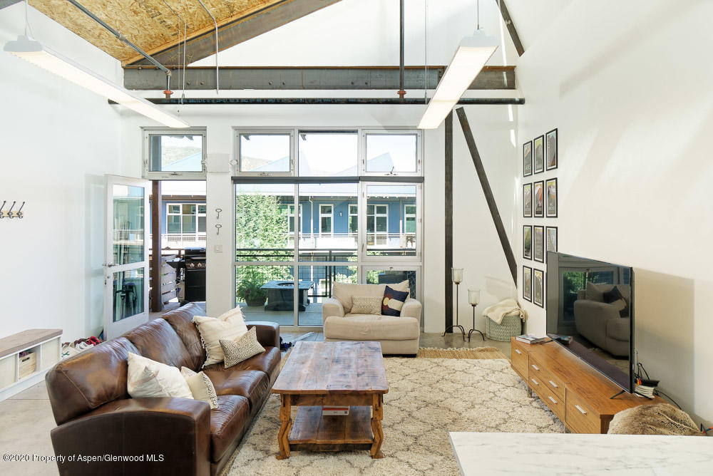 28 Widget Street, Unit 415 Basalt, CO 81621 - Photo 2 of 12 a living room with furniture and large windows