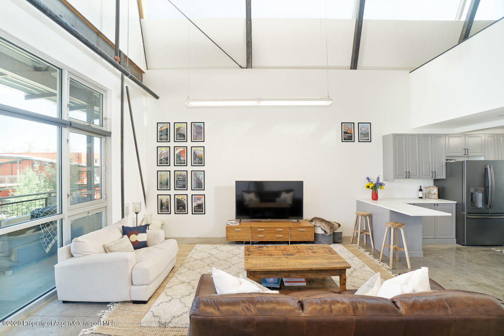 28 Widget Street, Unit 415 Basalt, CO 81621 - Photo 3 of 12 a living room with furniture and a flat screen tv