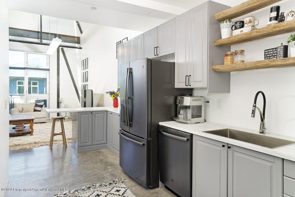 28 Widget Street, Unit 415 Basalt, CO 81621 - Photo 4 of 12 a kitchen with a sink and refrigerator