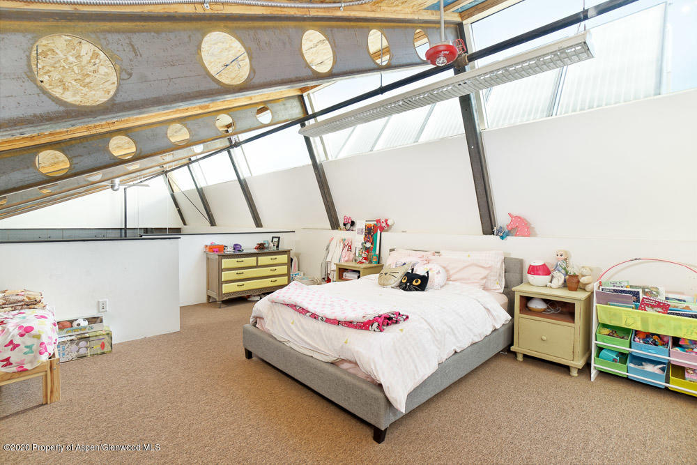 28 Widget Street, Unit 415 Basalt, CO 81621 - Photo 8 of 12 a bedroom with a bed and a window