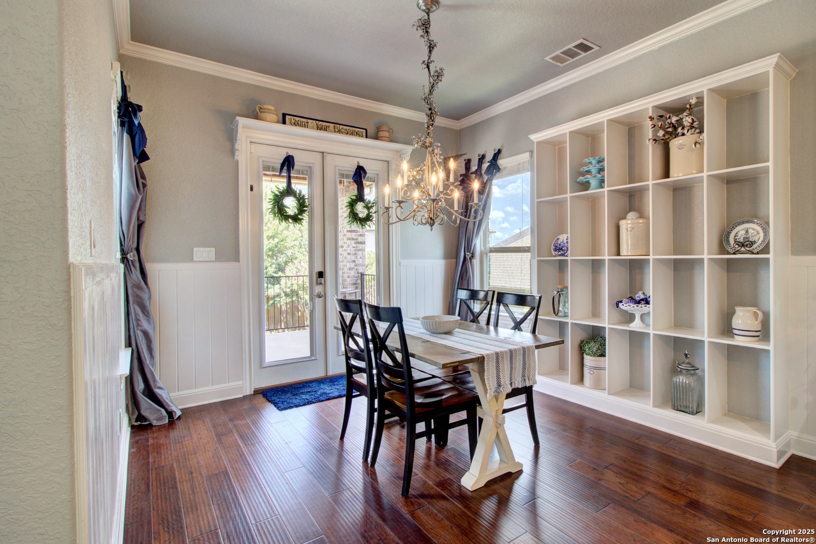 28518 Tristant Ridge San Antonio, TX 78260 - Photo 14 of 43 a view of a dining room with furniture window and wooden floor